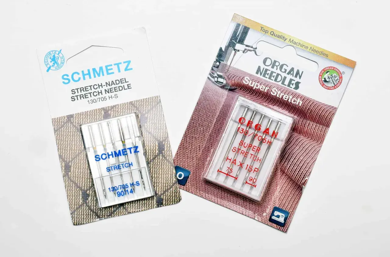 Two packages of sewing machine needles for knits: Schmetz Stretch and Organ Super Stretch.