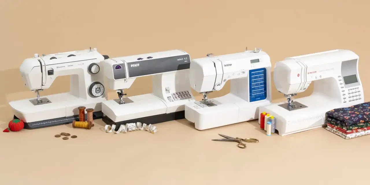 Four sewing machines from Husqvarna Viking, Pfaff, Brother, and Singer are displayed, along with spools of thread, scissors, and fabric. This image helps illustrate how to buy a sewing machine.